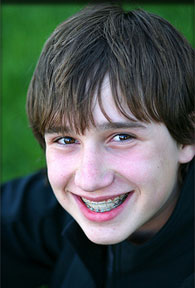 stock photo of a teen boy with braces